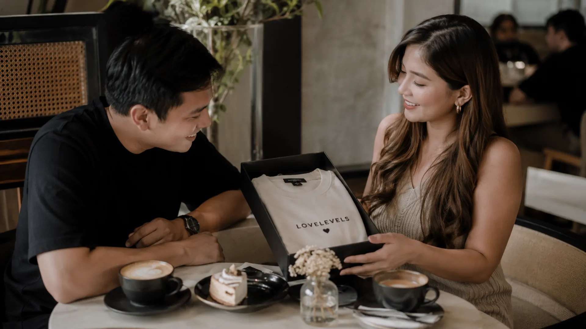 Anniversary gifts for him shown in a cozy romantic cafe date setting