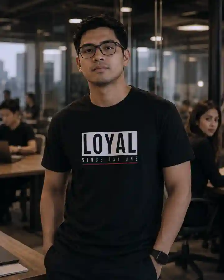 Filipino man wearing a black LoveLevels “LOYAL Since Day One” shirt i WP Filipino man wearing a black LoveLevels “LOYAL Since Day One” shirt i WP