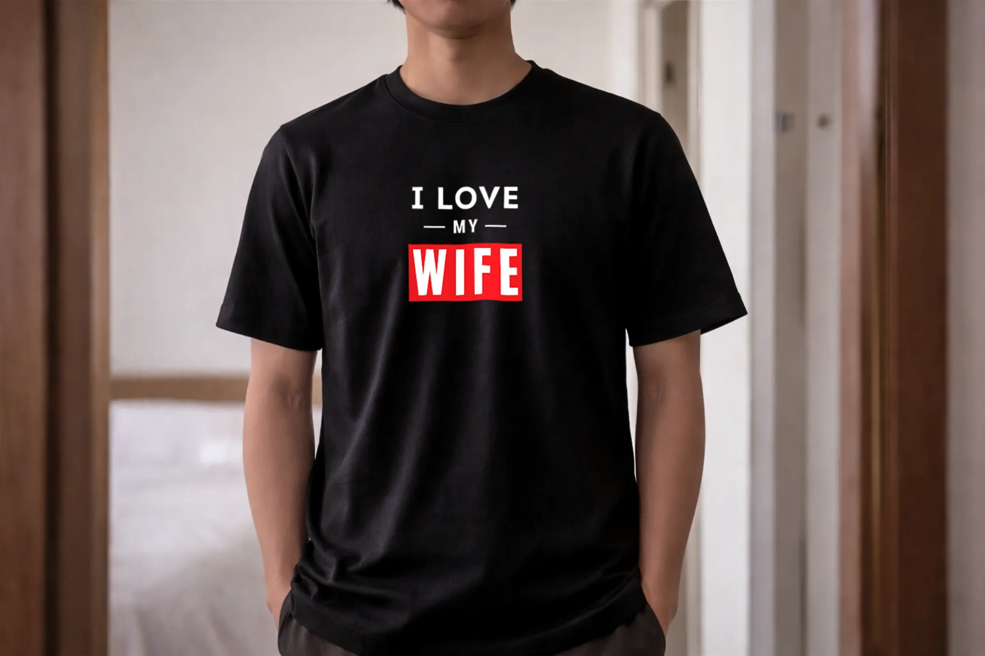 Man wearing black I LOVE MY WIFE relationship shirt inside public train commute